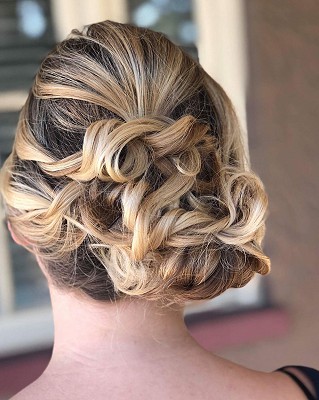 Back view of a blonde woman in bridal hairstyle