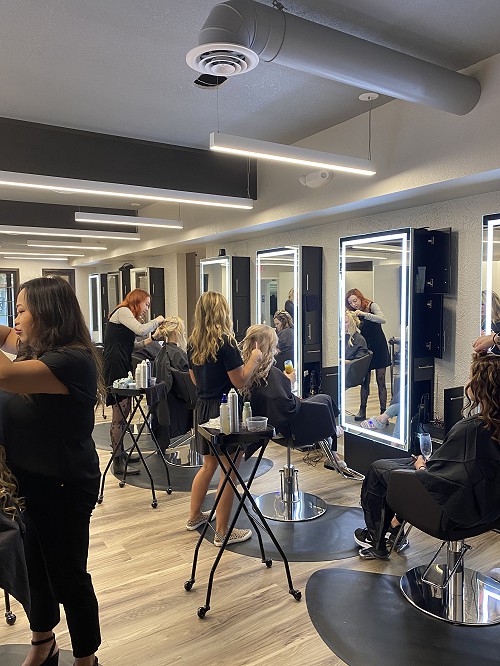 hairstylists tending to their customers' hair